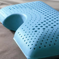 Close-up of the Malouf shoulder cutout and zoned ventilation holes for enhanced airflow and head support.
