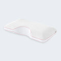 Side sleeper memory foam pillow with ergonomic shoulder cutout to align spine and reduce pressure.
