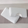 Standard and shoulder cutout Malouf Bamboo Charcoal pillows on a bed for versatile, cool sleep support.
