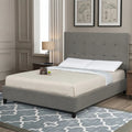 Lifestyle view of the Hudson tufted bed frame by South Bay in a modern grey bedroom setting.

