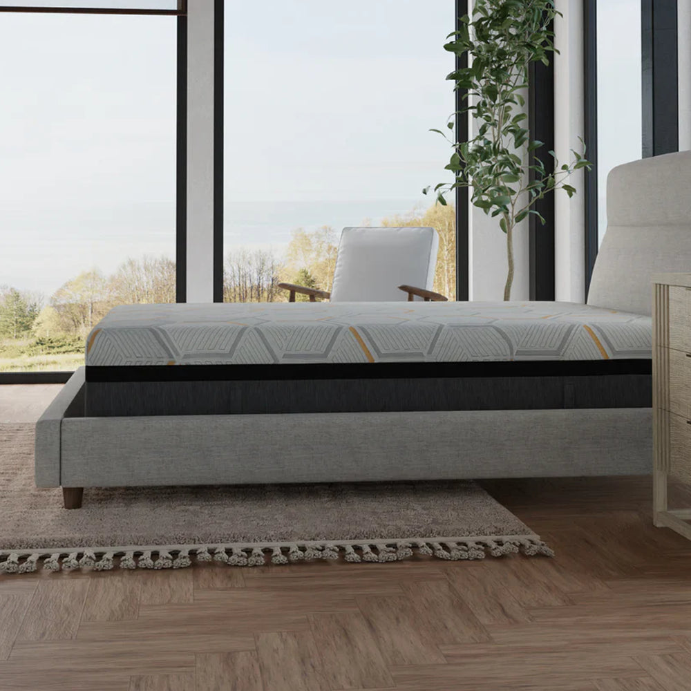 Full side profile of the South Bay 14-inch plush hybrid copper-gel mattress showing the multi-layer construction and supportive charcoal grey base.
