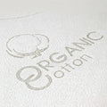 Detailed embroidered "Organic Cotton" logo on the Bundle of Dreams water-repellent crib sheet.
