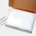 Unboxing the GhostPillow Faux Down pillow, highlighting its breathable and machine-washable design.
