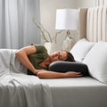 Woman sleeping on a Malouf HexCurve pillow for orthopedic neck support and better spinal alignment.
