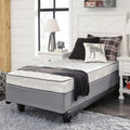 Ashley Sleep Bonnell 6 inch firm mattress in a modern white and grey guest or kids' bedroom setup.
