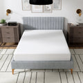 Full frontal view of the South Bay EcoCore Origin medium firm mattress showcasing the sleep surface and minimalist bedroom decor.
