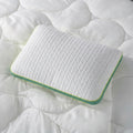 BEDGEAR Astro Kids cooling pillow with textured moisture-wicking cover on white bedding.
