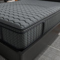 Close-up corner detail of the Allureluxe Bamboo Hybrid Elite mattress showcasing the premium charcoal grey fabric and reinforced side support.
