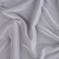 Breathable knit texture of a grey Dri-Tec performance crib sheet for temperature regulation.
