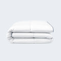 Side view of a folded SleepTone Tranquility comforter highlighting its high-loft insulation.
