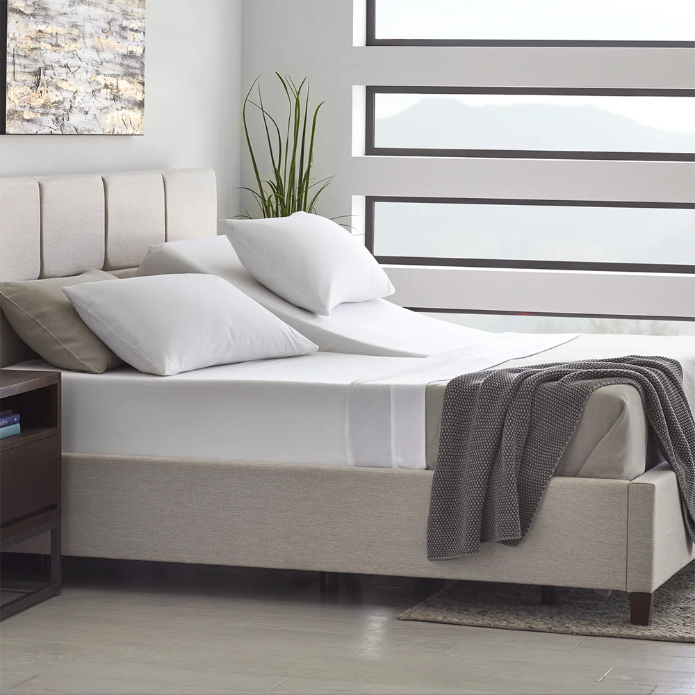 Close-up of the durable steel mattress retainer bar at the foot of the Malouf E455 smart adjustable foundation.
