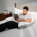BEDGEAR Body Pillow used for back support while sitting up in bed to read or use a tablet comfortably.
