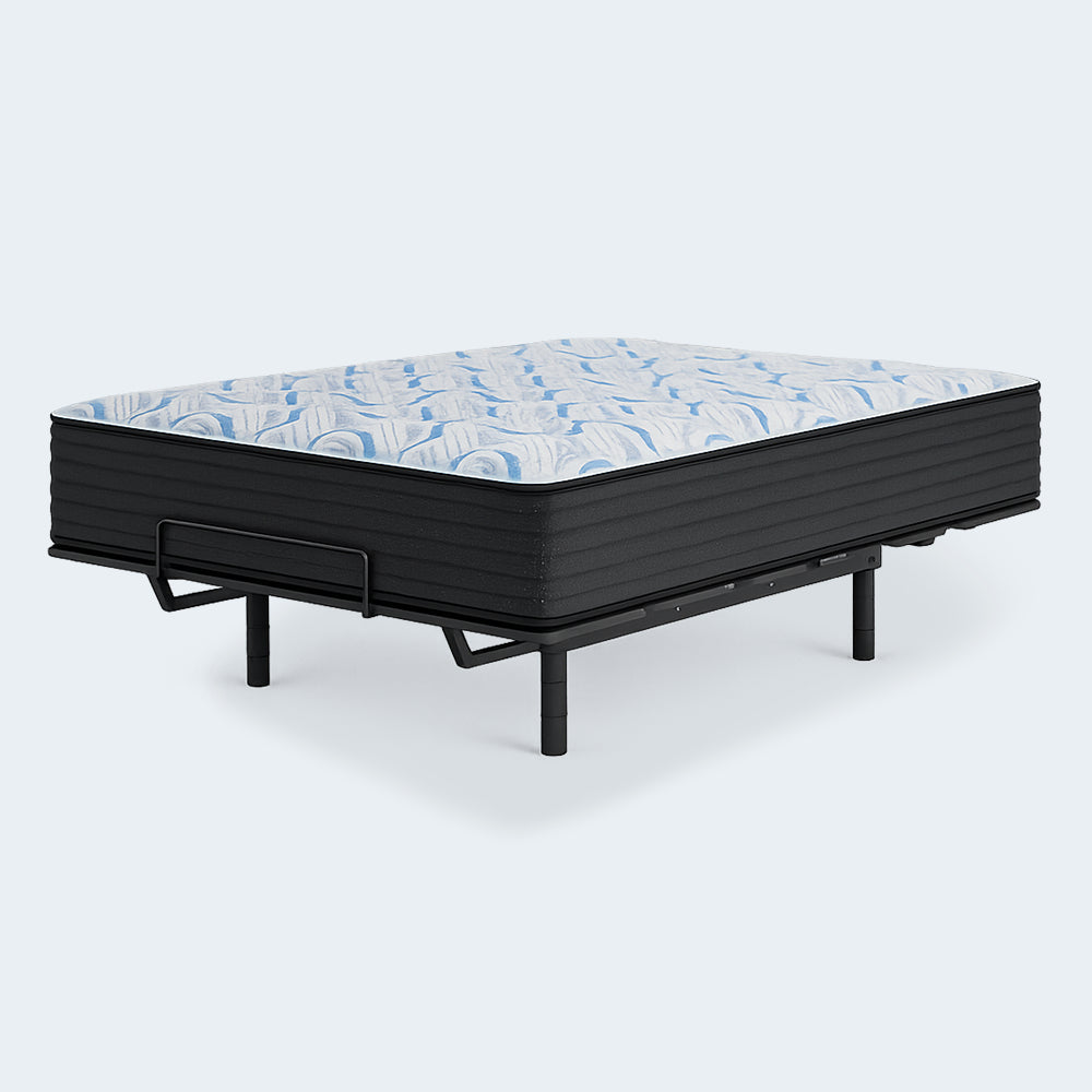 The 14-inch firm Elite Springs mattress by Ashley displayed on a flat adjustable bed frame with a secure mattress retainer bar.
