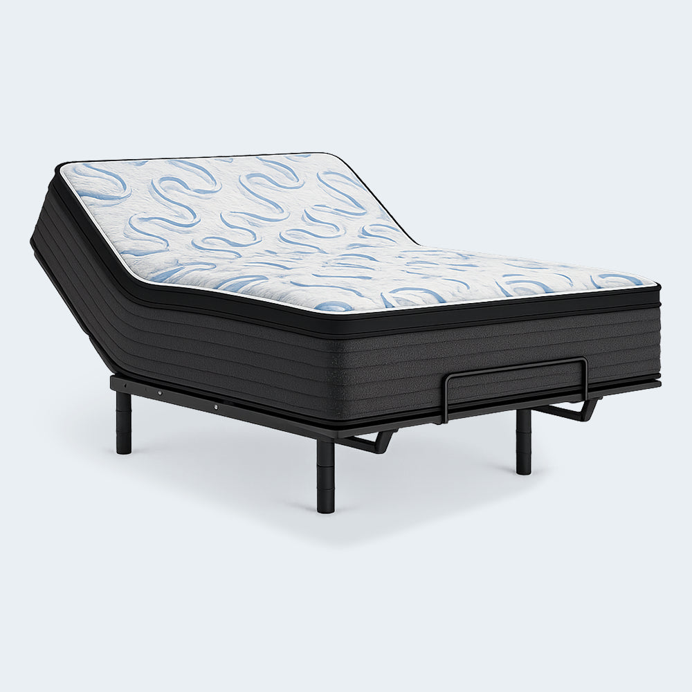Ashley Elite Springs 14-inch plush mattress with the head section elevated on an adjustable base to showcase flexible hybrid construction.
