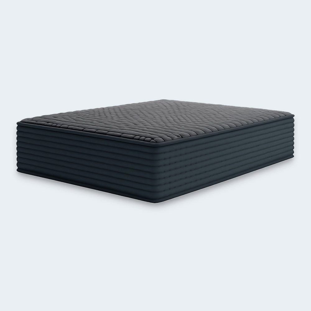 Profile view of the 12-inch Gray 1200 Hybrid mattress highlighting its thick supportive layers and horizontal channel-quilted sides.

