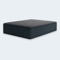 Profile view of the 12-inch Gray 1200 Hybrid mattress highlighting its thick supportive layers and horizontal channel-quilted sides.
