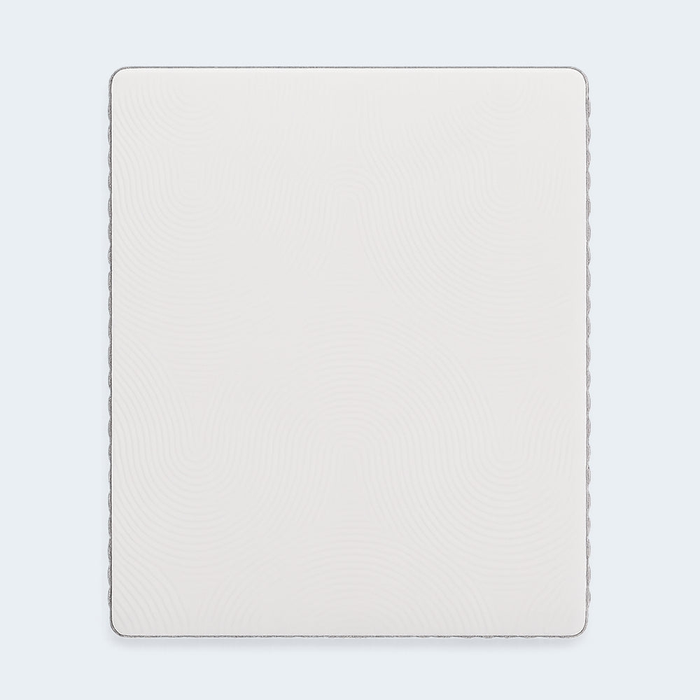 Direct top-down view of the Terra Sleep mattress surface featuring a breathable white stretch-knit cover designed for cooling airflow.
