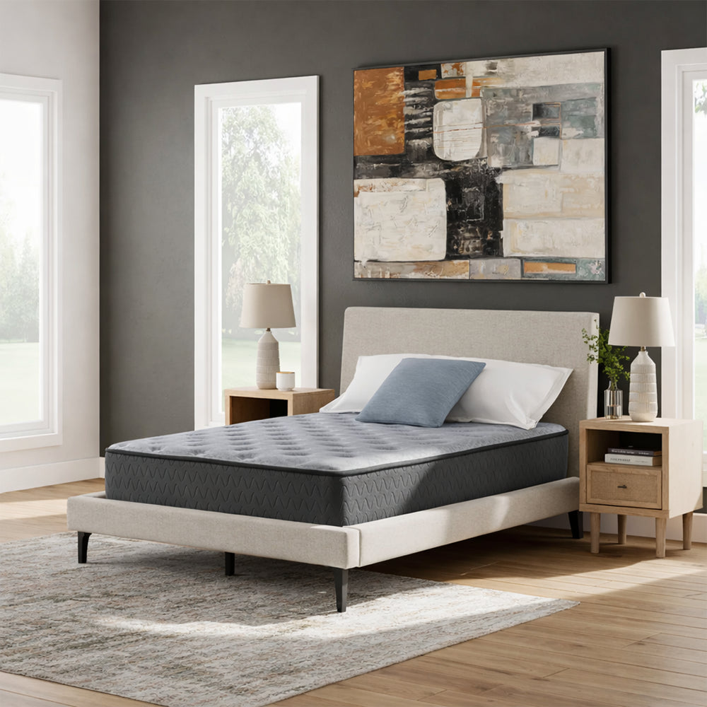 Modern bedroom interior featuring the Comfort Plus 10 Inch Medium Mattress on a minimalist upholstered platform bed frame.
