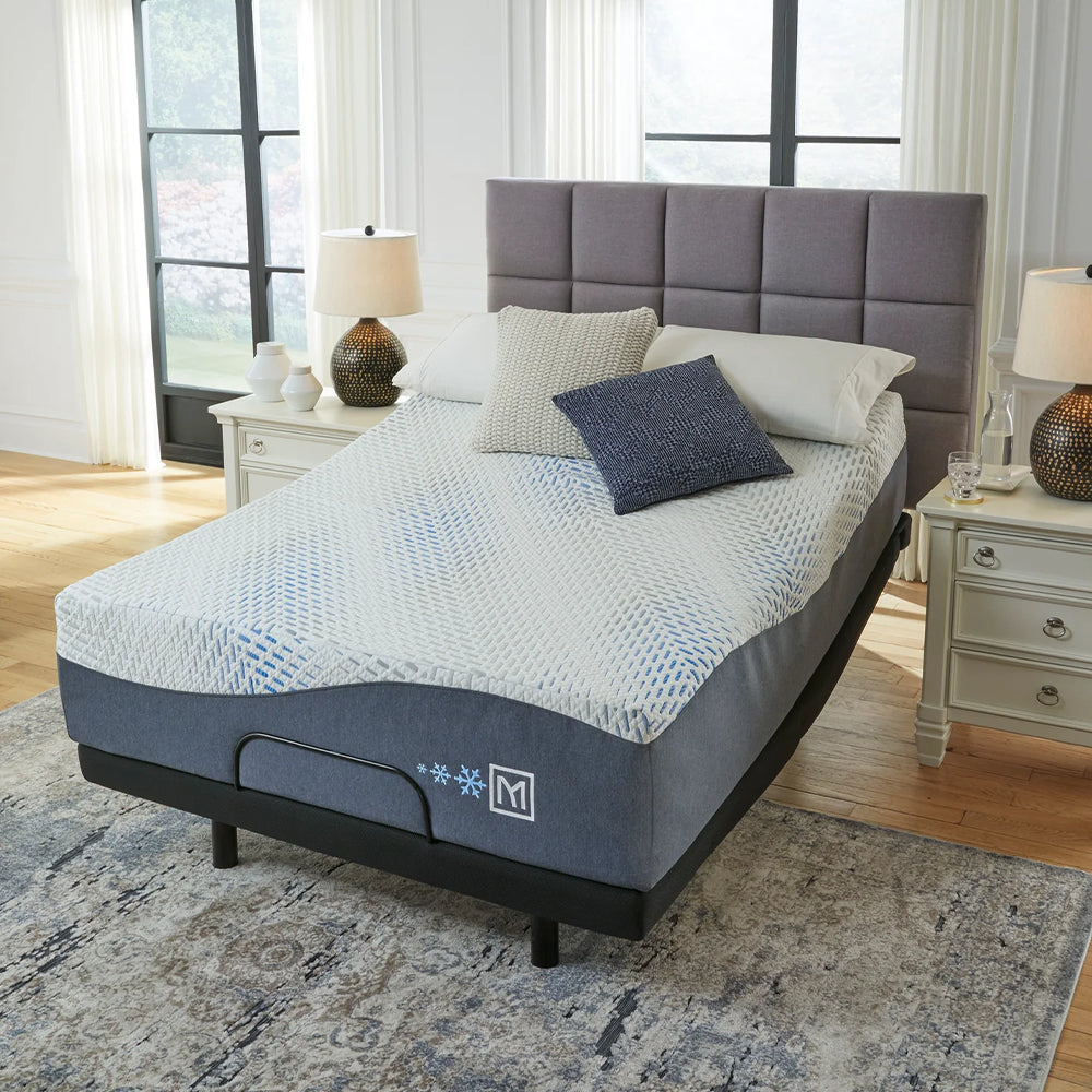 High-angle bedroom view of the Millennium Luxury Gel Memory Foam Mattress with the head section elevated on an adjustable base for reading comfort.
