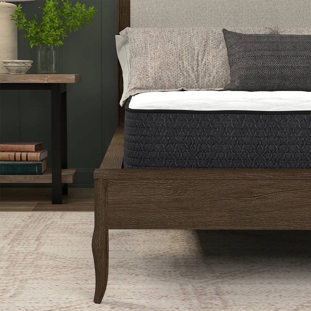 Side profile of the 8-inch American Bedding Classic Mattress illustrating the medium-firm support and breathable fabric construction.
