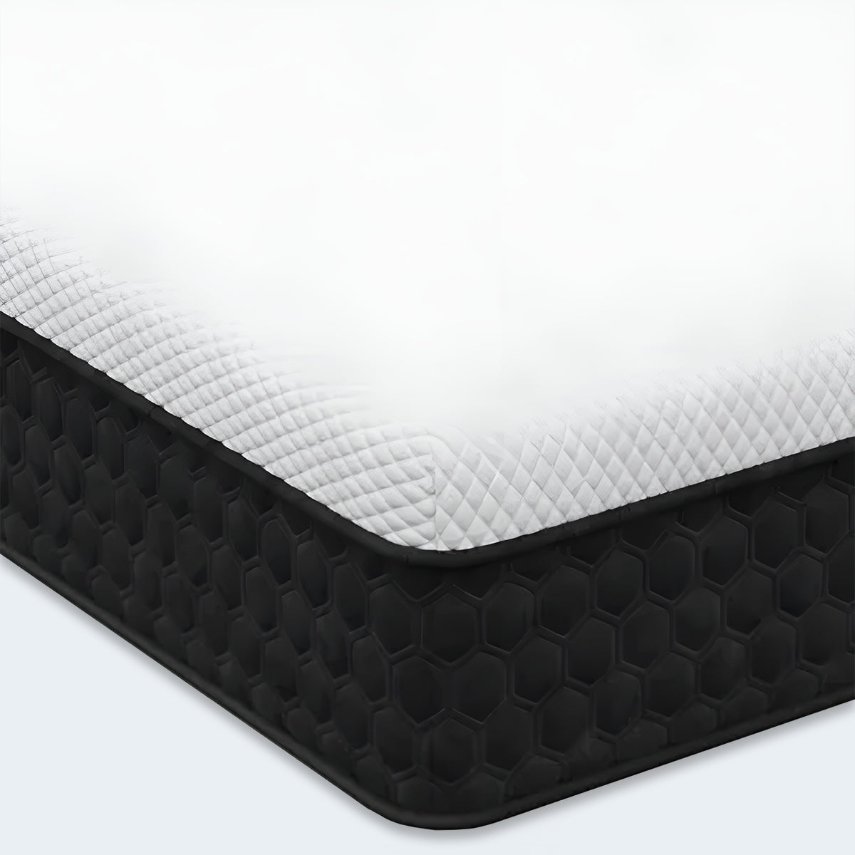 Close-up of Response Copper 12 inch cool hybrid mattress corner with white and black honeycomb fabric.