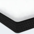 Close-up of Response Copper 12 inch cool hybrid mattress corner with white and black honeycomb fabric.
