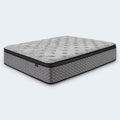 Angled view of the Augusta 12 inch Firm Pillow Top Mattress with a white tufted cover and grey wavy side panels.