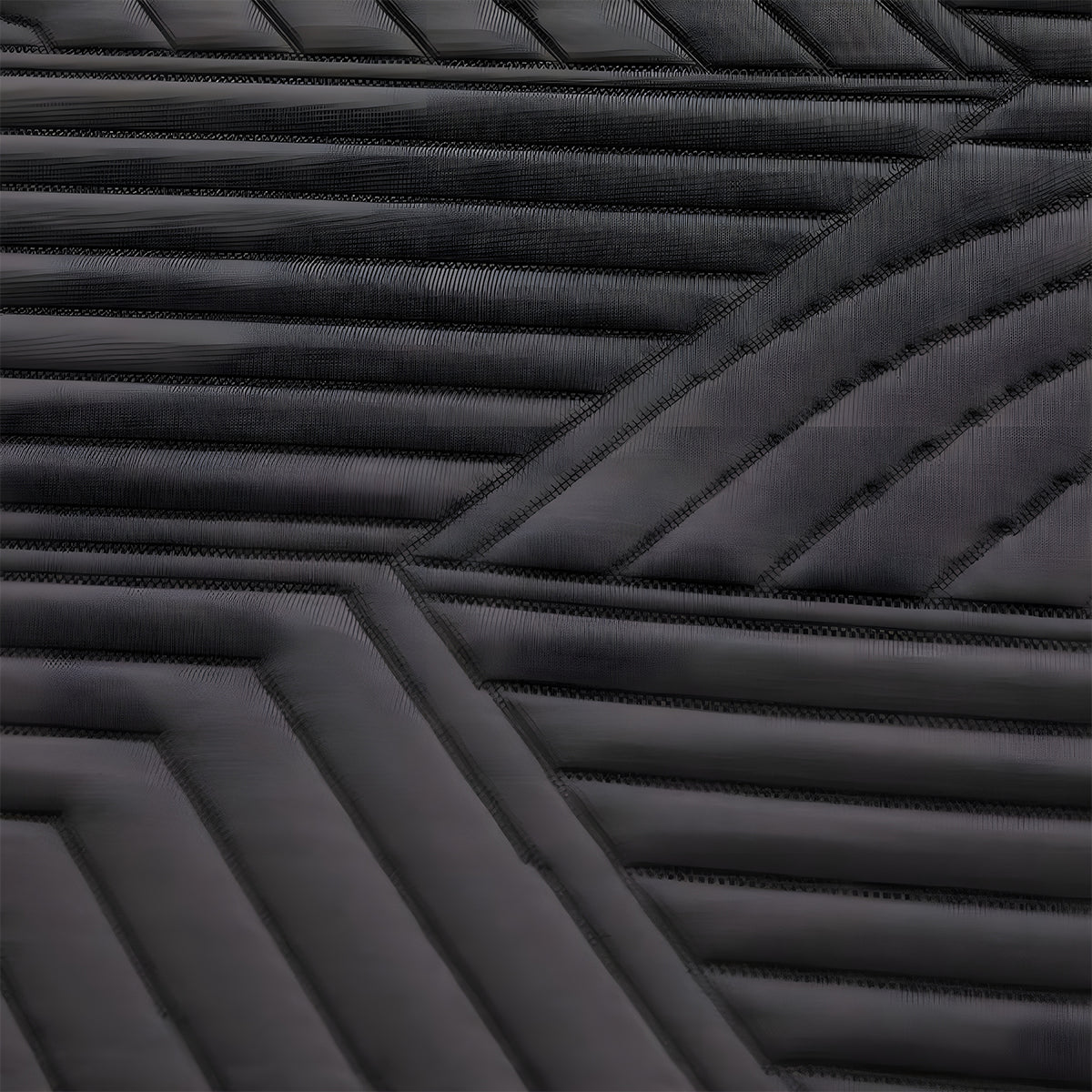 Extreme close-up of the Ice Cloud 13" ActivAir Hybrid Mattress wavy black fabric designed for moisture management.
