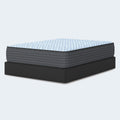 Ashley Destin Cove 15-inch ultra plush Euro top mattress sitting on a low-profile black box spring foundation for traditional support.
