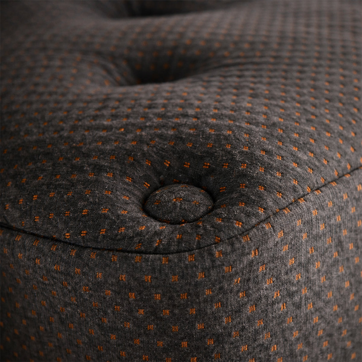 Detailed shot of the Tommie Copper Core Znergy mattress corner highlighting the copper-infused fabric and tufted plush top.
