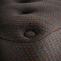 Detailed shot of the Tommie Copper Core Znergy mattress corner highlighting the copper-infused fabric and tufted plush top.
