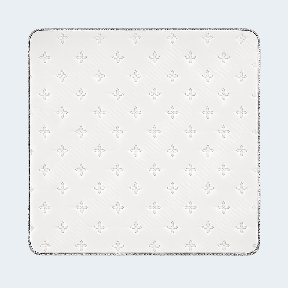 Overhead view of the Americanstar Bluesky Ultra Euro Top mattress highlighting the elegant flower-quilted white breathable cover.
