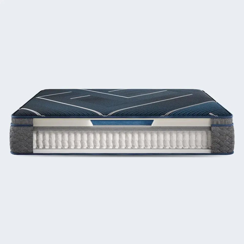 Beautyrest World Class Hybrid cutaway showing pocketed coil support and cooling pillow top layers.
