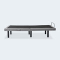 Front-facing side profile of the Malouf M555 wireless adjustable bed foundation in its neutral flat position.
