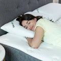 Woman sleeping on a GhostPillow shredded memory foam cooling pillow with an adjustable, supportive design.
