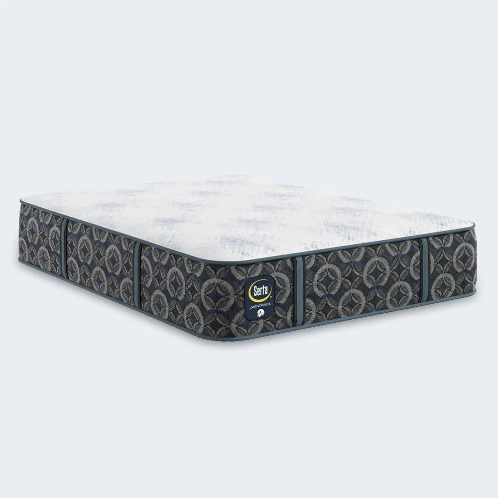 Angled view of the Serta Cascade Bluff Hybrid Firm mattress with breathable top fabric for cool sleep.
