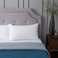 Malouf Prime pillow protector on a bed for quiet, waterproof, and hypoallergenic protection.
