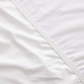 Durable waterproof H2Pro membrane on the underside of a Malouf mattress protector for spill protection.
