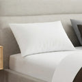 South Bay Luxury Resort Pillow styled on a bed for premium comfort and hotel-grade neck support.
