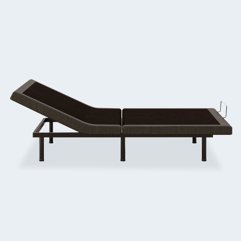 Side profile of the Comfort Premier Steel motorized bed frame by Ashley with the head fully elevated for watching TV in bed.
