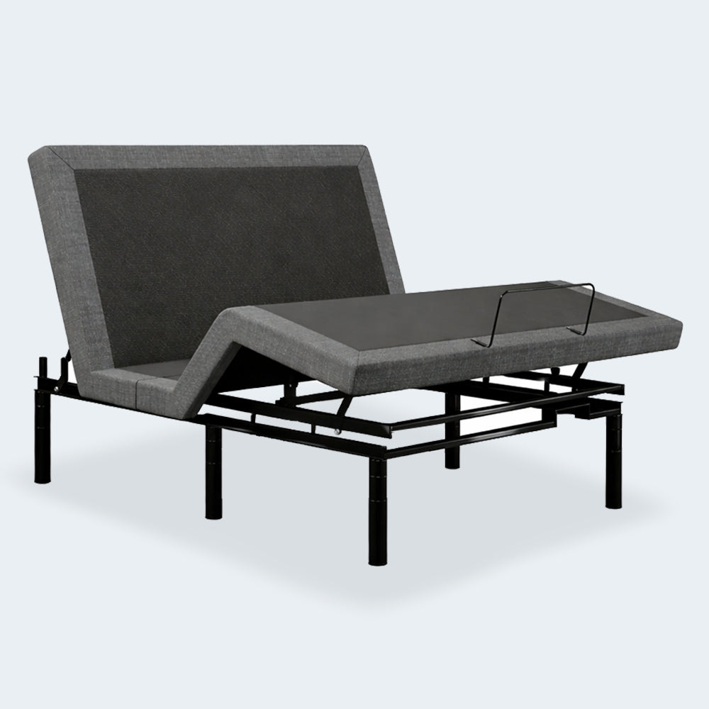 iDealBed Smart 3i Custom Adjustable Bed Base with independent head and foot incline, featuring grey fabric upholstery and a black metal frame.
