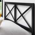 Close-up detail of the high-quality matte black finish on the durable Malouf Taylor geometric metal headboard.