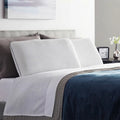  Pair of Malouf Weekender gel memory foam pillows on a bed offering luxury cooling and cervical support.