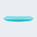 Side profile of a ventilated blue gel memory foam pillow showing its cooling air-flow design.

