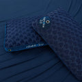 BEDGEAR Night Ice pillows on navy sheets, highlighting the low-loft 0.0 option for stomach sleepers.