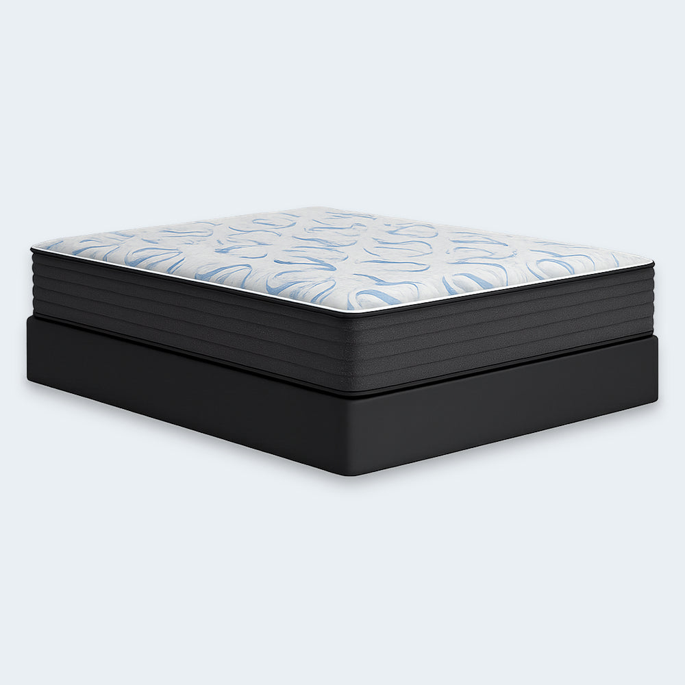 Side view of the Ashley Elite Springs 14-inch firm mattress supported by a sturdy black foundation box spring.
