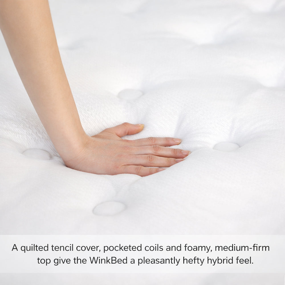 Hand pressing into the quilted Tencel cover of a WinkBed to demonstrate the responsive cushion-firm feel and high-density foam support.
