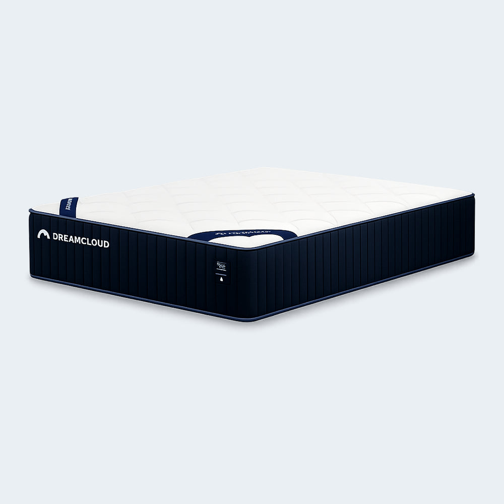 High-angle perspective view of the DreamCloud Classic 12-inch mattress showcasing the scalloped quilted surface and luxury 12” profile depth.