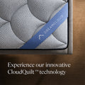 Top-down corner detail featuring the DreamCloud branded luxury strap and innovative CloudQuilt technology performance fabric.
