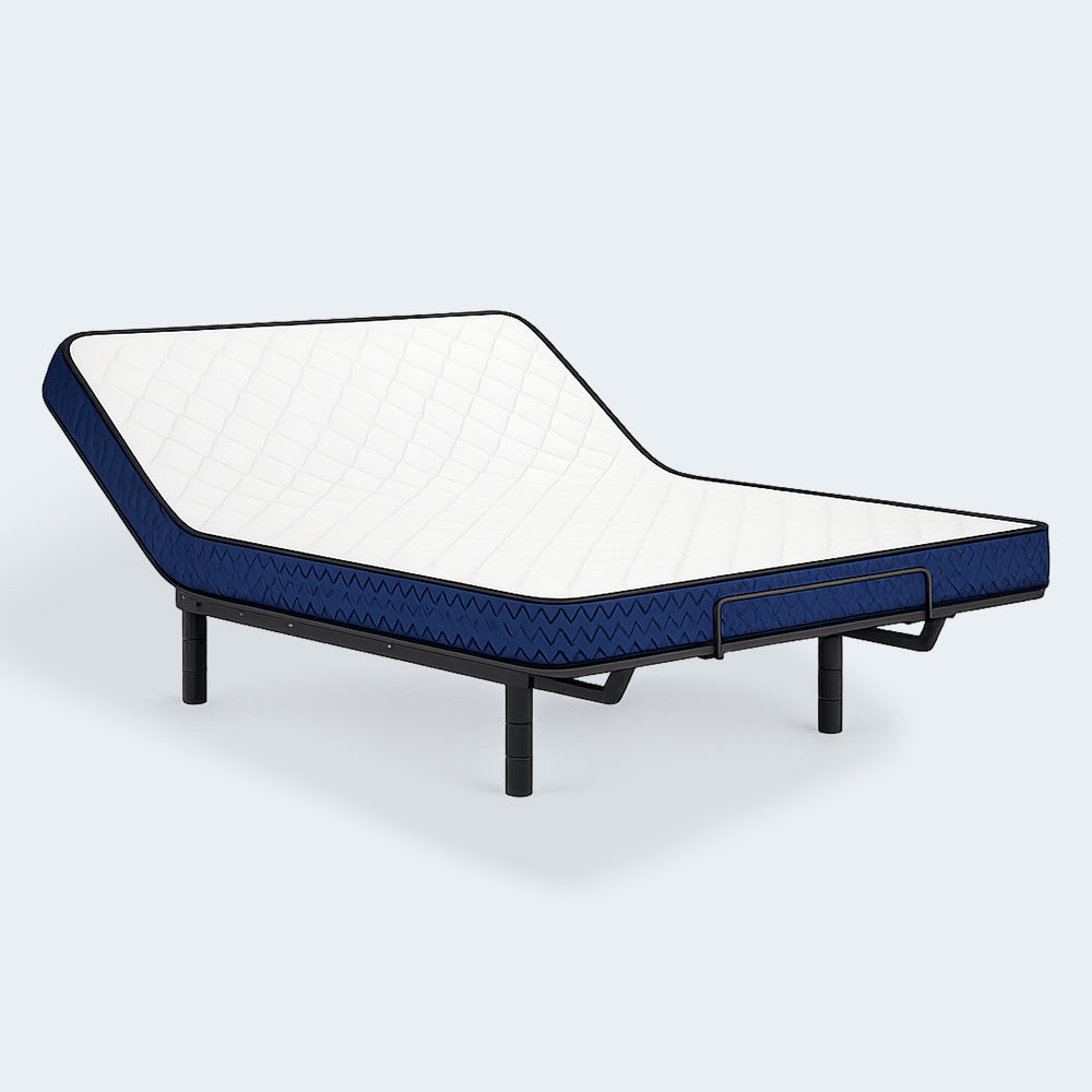 Side angle of the Ashley Firm 6-inch Mattress elevated on an adjustable base to provide targeted pressure relief for back and side sleepers.
